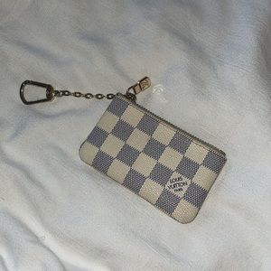 white checkered coin pouch